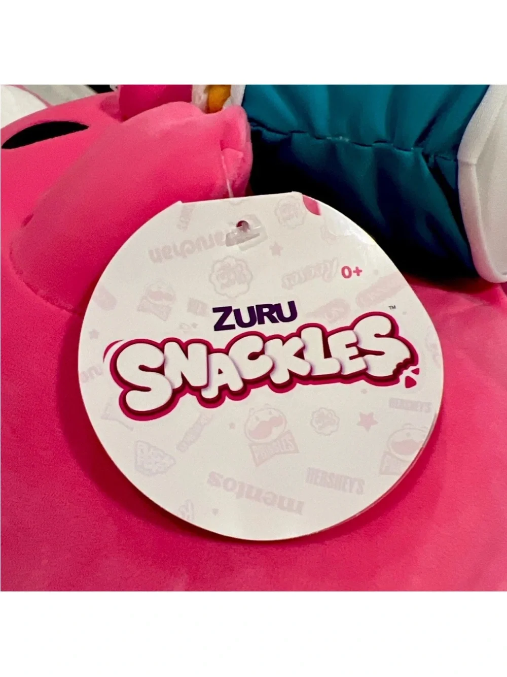 SNACKLES 14” Pink Bunny Super Plush Toy holding a Cinnabon Cinnamon Roll By Zuru